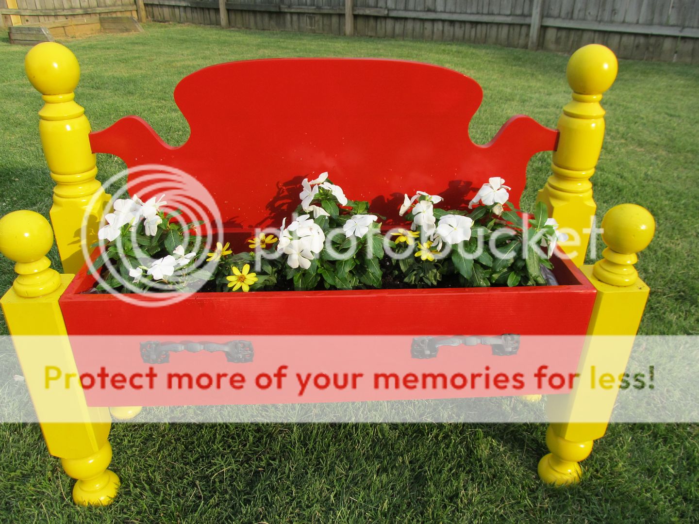 repurposed bed into a flower bed